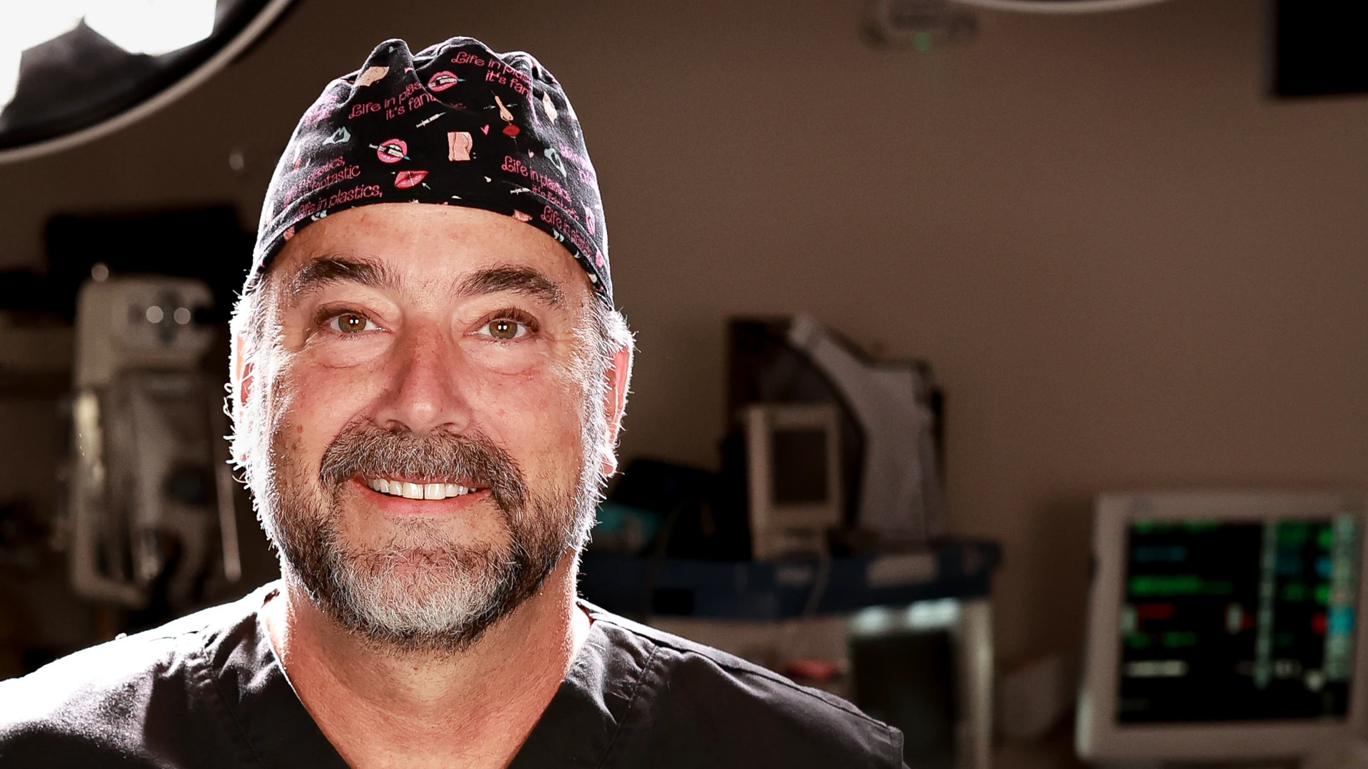 Dr. C. Brett Carlin, board-certified plastic surgeon, in the operating room